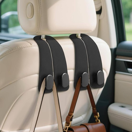 Leather car seat headrest hook by FIZZI SHOP attached to headrest, ideal for hanging bags and accessories in vehicle.