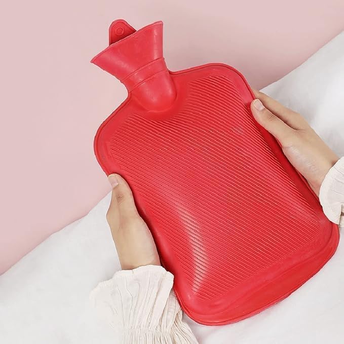 FIZZI SHOP JK SIDHU 1000 ml hot water bag with red fabric cover for soothing warmth and pain relief.