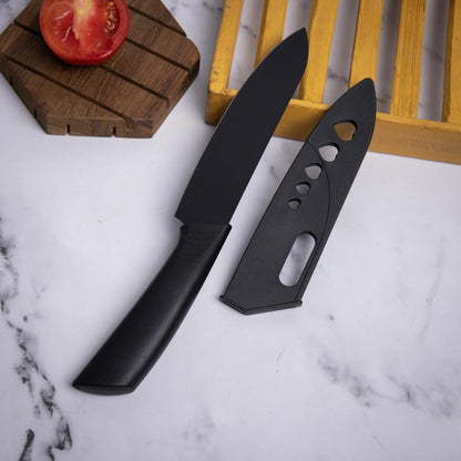 Set of three FIZZI SHOP JK SIDHU kitchen knives with stainless steel blades and black handles on a cutting board.