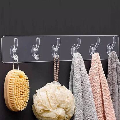 Six black self-adhesive hook stickers from FIZZI SHOP shown on a wall for hanging lightweight items.