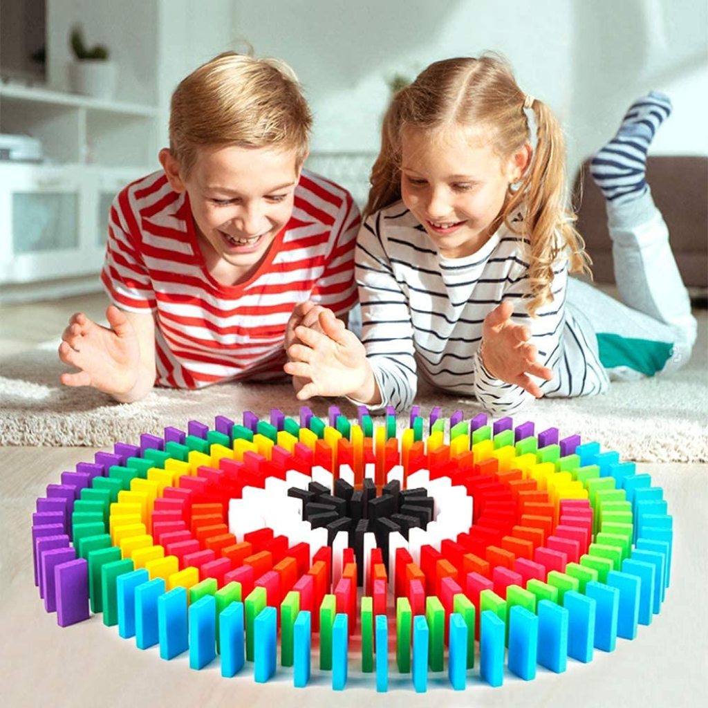 Set of 120 wooden dominoes with natural finish, arranged in a box for the FIZZI SHOP JK SIDHU domino game.