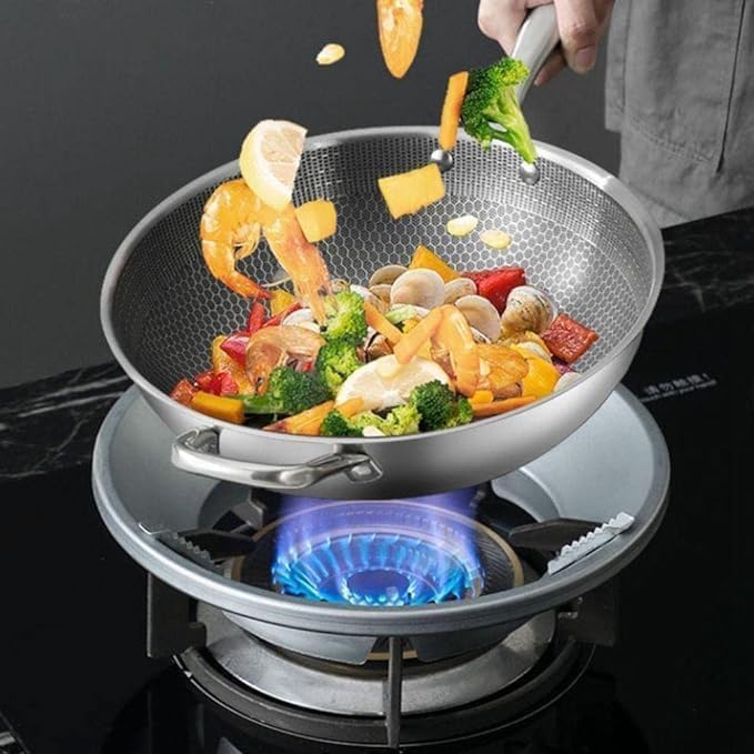 FIZZI SHOP Gas Saver Stove Protector Stand shown on kitchen stove, designed to protect surfaces and improve safety during cooking.