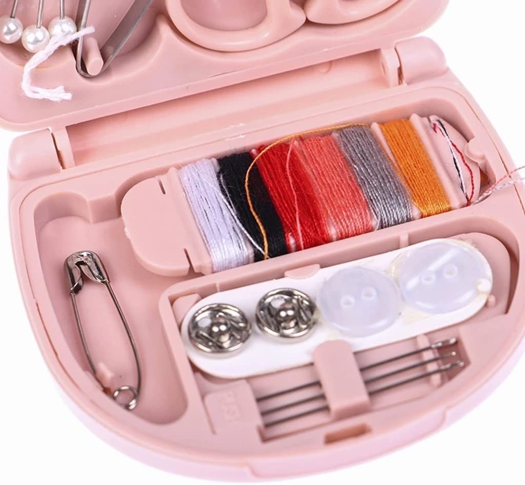 Mini travel sewing kit by FIZZI SHOP JK SIDHU with colorful threads, needles, and small sewing accessories in a compact case.