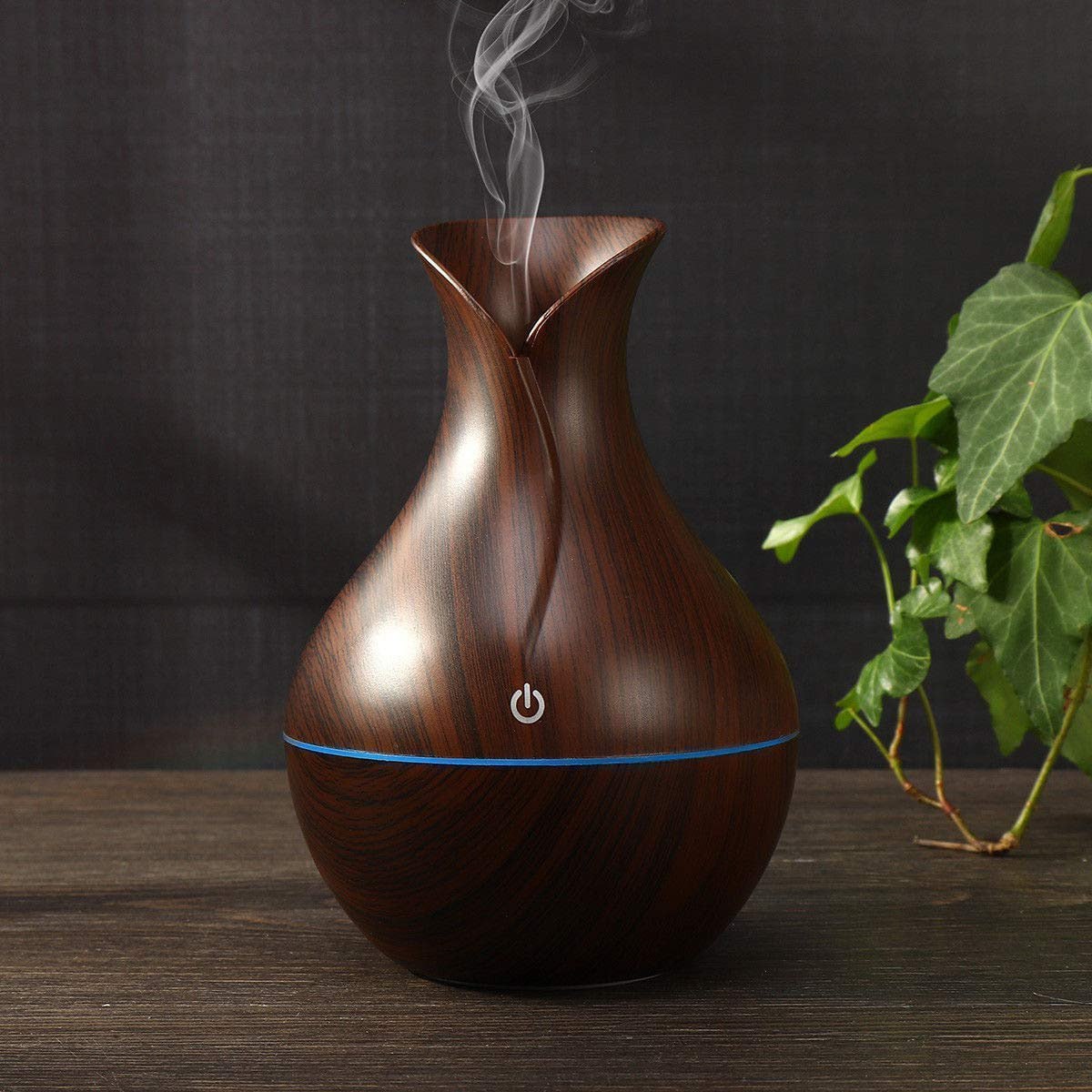 Pot-shaped wooden humidifier by FIZZI SHOP JK SIDHU, featuring a natural wood finish and a compact design for home moisture control.