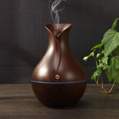 Pot-shaped wooden humidifier by FIZZI SHOP JK SIDHU, featuring a natural wood finish and a compact design for home moisture control.
