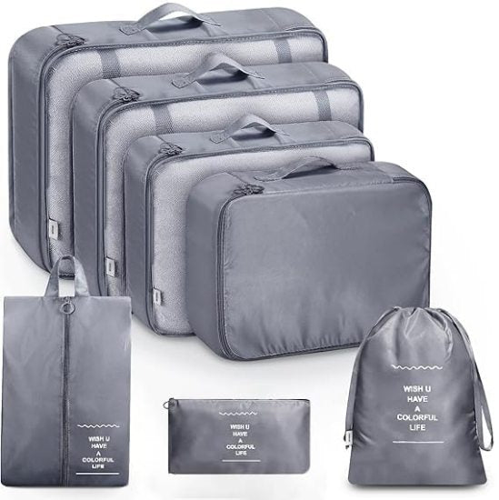 Seven-piece FIZZI SHOP travel organizer pouch set with zipped compartments, ideal for packing toiletries and accessories.