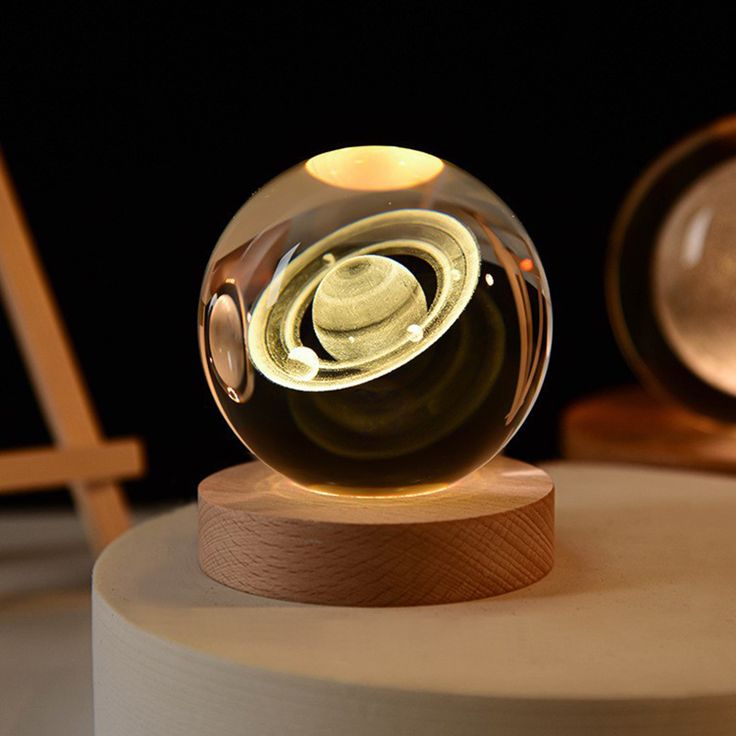 3D crystal ball night lamp by FIZZI SHOP glowing with colorful LED lights, decorative glass globe on a sleek black base