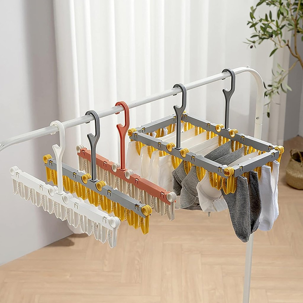 Foldable cloth dryer hanger by FIZZI SHOP, showing a compact, foldable metal and plastic hanger for drying clothes efficiently.