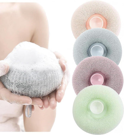 Round loofah scrubbing brush from FIZZI SHOP with textured natural fibers for gentle exfoliation and skin cleansing.