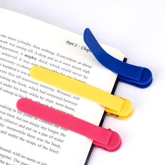 Three silicone automatic bookmarks in bright colors, designed for easy page marking and reading convenience.