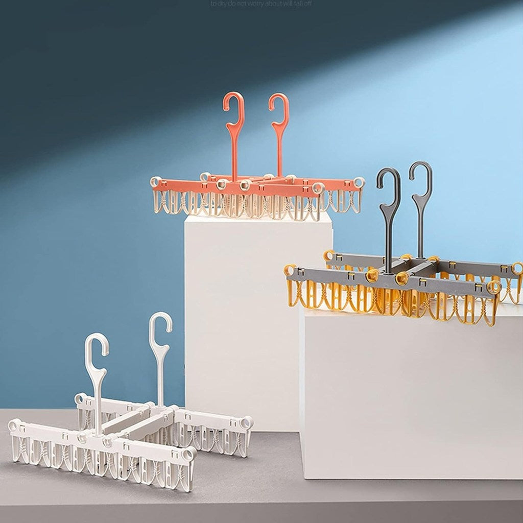 Foldable cloth dryer hanger by FIZZI SHOP, showing a compact, foldable fabric hanger for drying clothes efficiently.