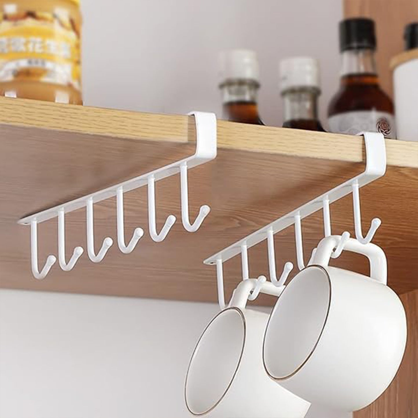 Small Wukusy metal multifunctional cabinet storage rack with multiple compartments for organizing kitchen or home essentials.