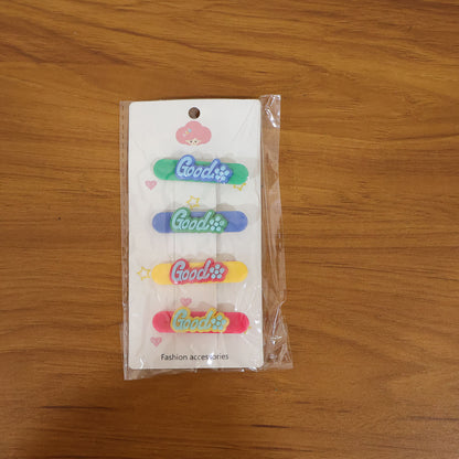 Set of four colorful Good Design hair clips by Wukusy, featuring vibrant patterns and practical hair accessory design.