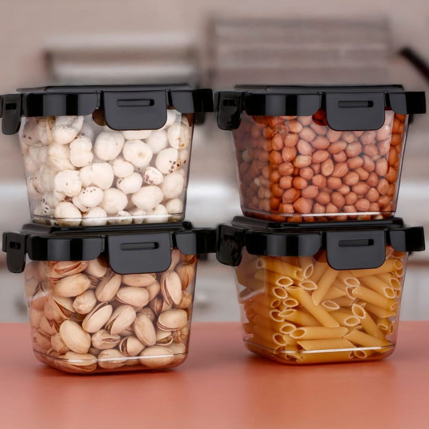 Four Wukusy plastic food storage containers with lids, 500ml capacity, for kitchen organization and food preservation.