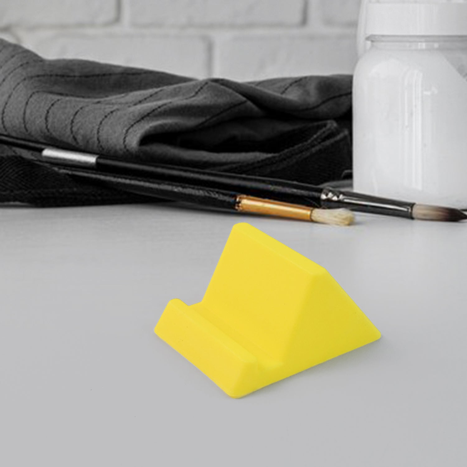 Wukusy compact plastic mobile phone holder stand in mixed colors, designed for hands-free viewing and stable support.