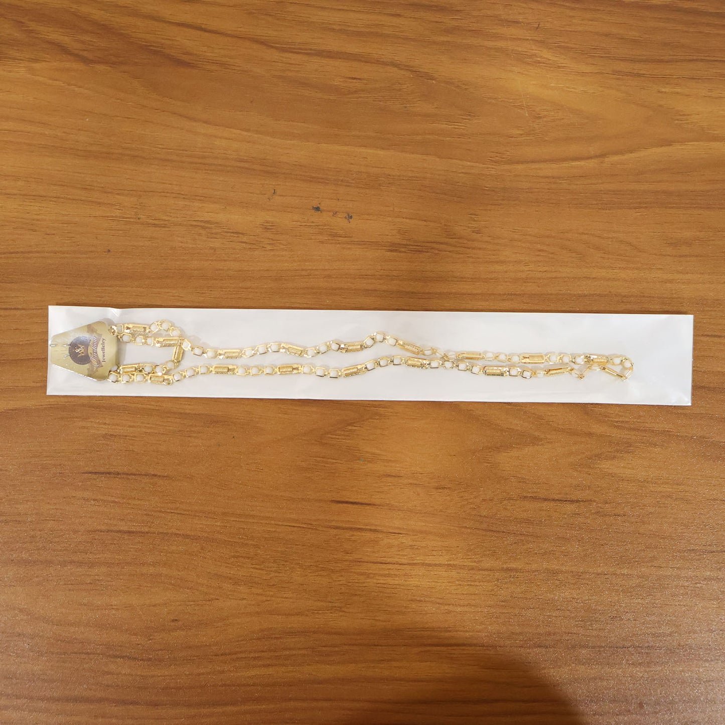 Gold-tone designer chain necklace by Wukusy, featuring a stylish and elegant link design, displayed on a neutral background.