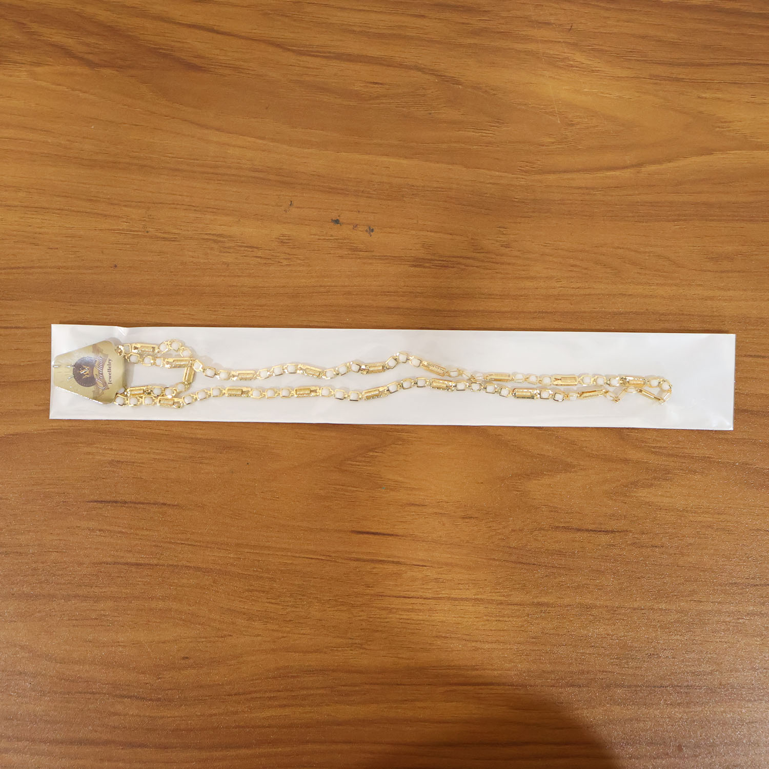 Gold-tone designer chain necklace by Wukusy, featuring a stylish and elegant link design, displayed on a neutral background.