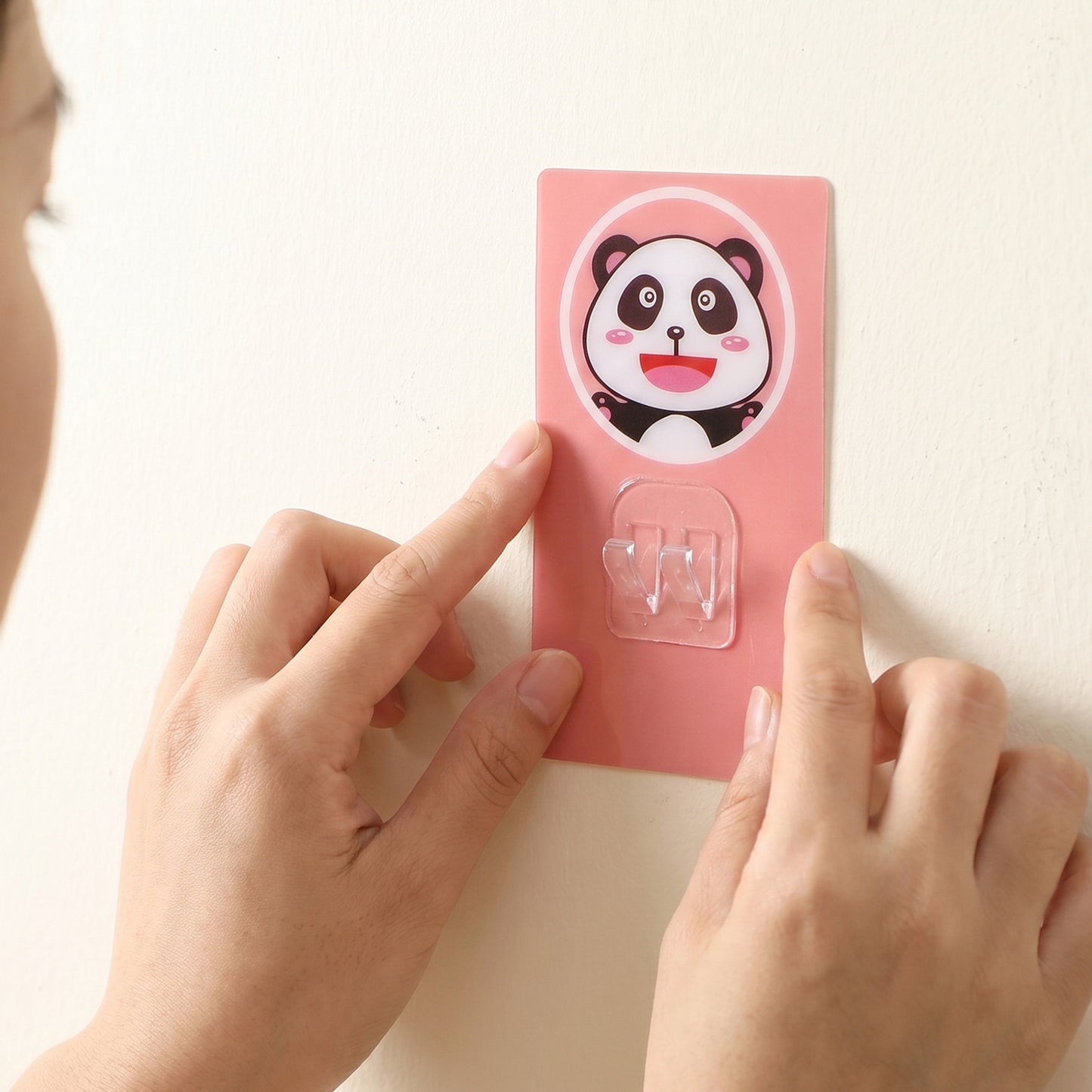 Wukusy cartoon adhesive plastic wall hook with strong hold, self-stick hanger for storage and organization on smooth surfaces.