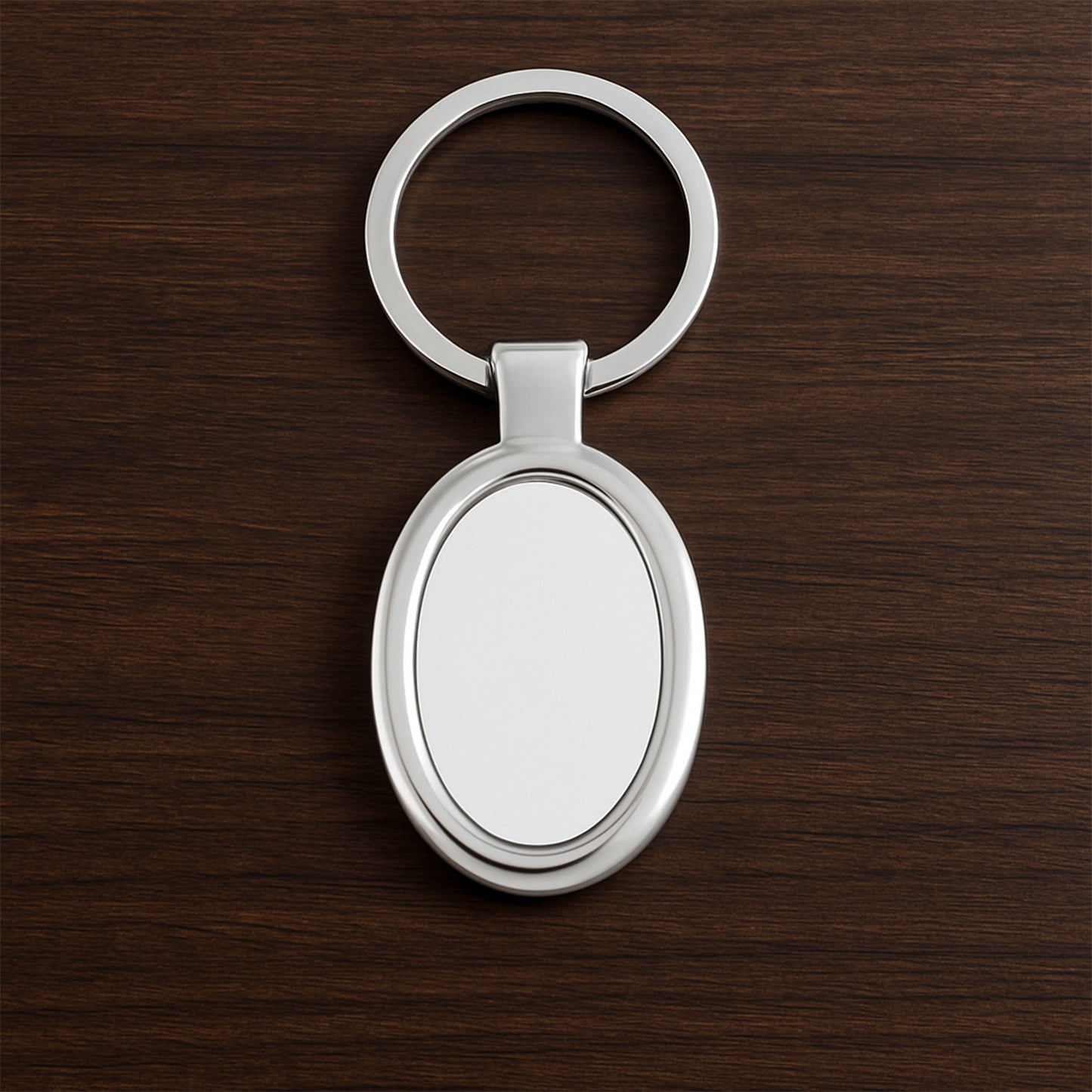 Elegant oval-shaped metal keychain by Wukusy with a polished finish, perfect for personal use or as a stylish accessory.