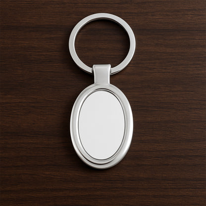 Elegant oval-shaped metal keychain by Wukusy with a polished finish, perfect for personal use or as a stylish accessory.