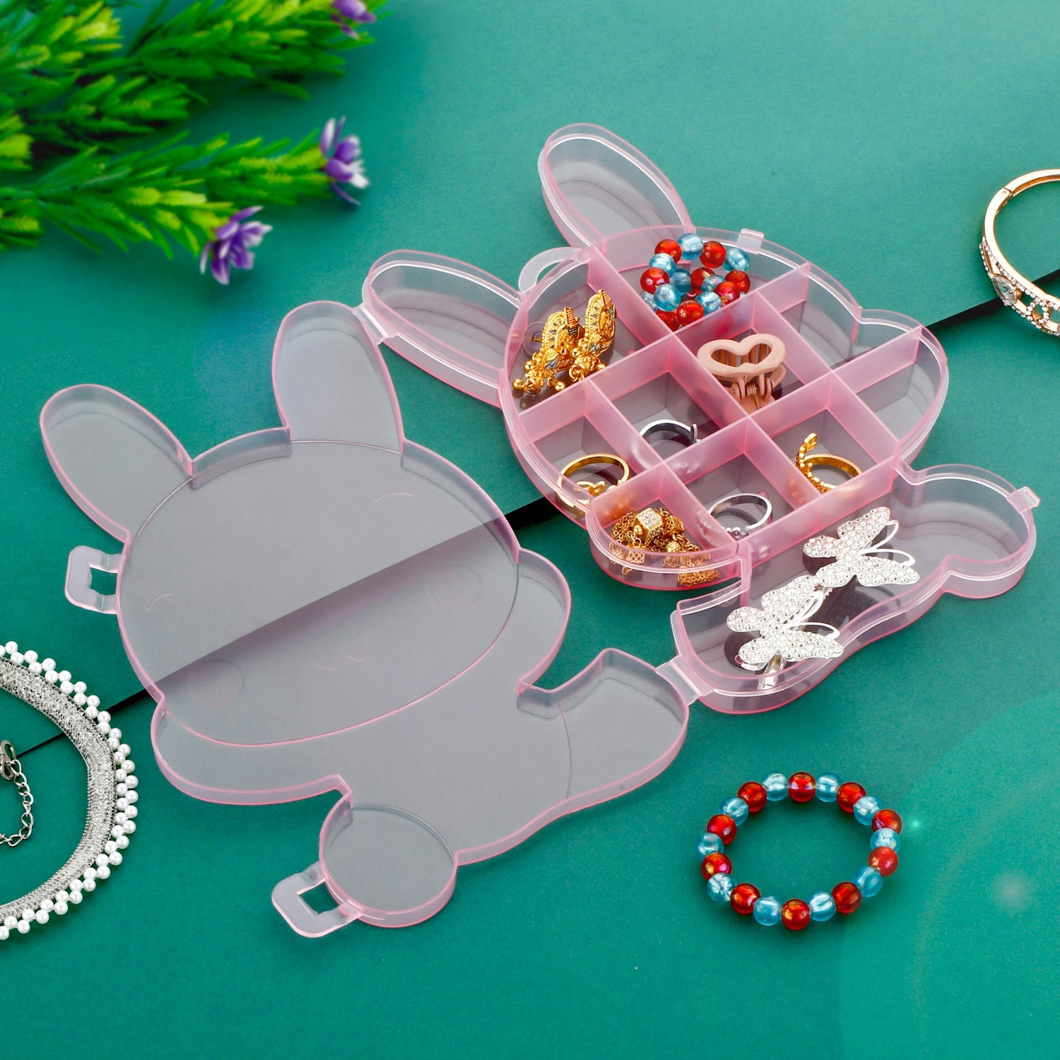 Wukusy transparent cartoon bear plastic jewelry storage box with compartments for organizing small jewelry and accessories.