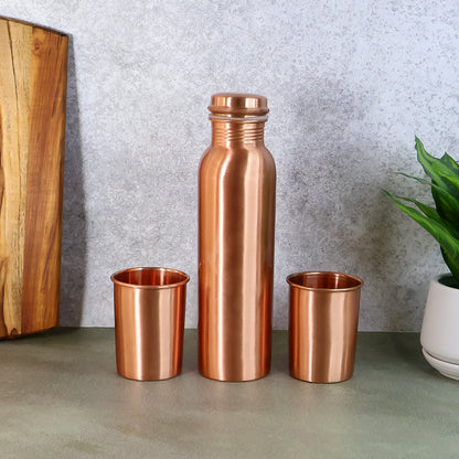 Wukusy copper water bottle with two glasses and gift box, 3-piece set, shown with the copper bottle and glasses on a white background.