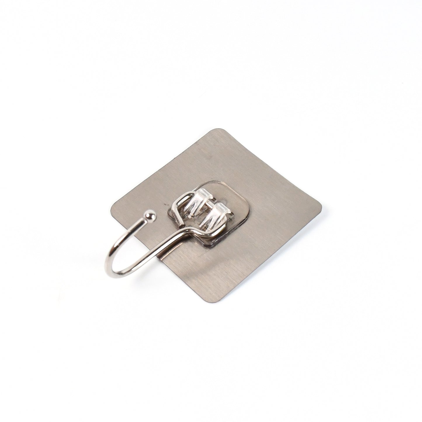Large stainless steel Wukusy self-adhesive wall hook for home and kitchen, shown attached to a wall holding lightweight items.