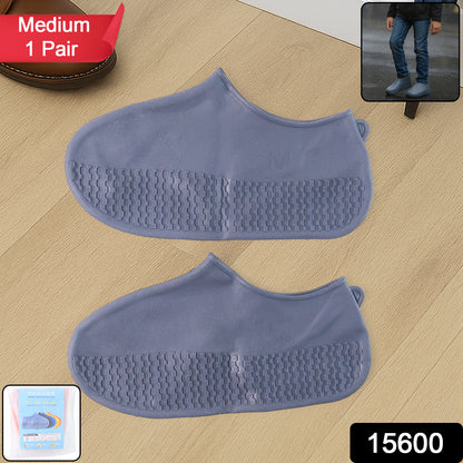 Pair of grey Wukusy non-slip silicone rain boot covers with waterproof, foldable design for travel protection.