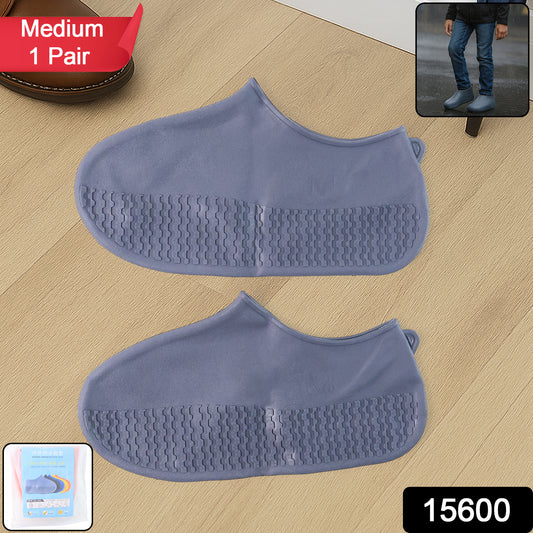 Pair of grey Wukusy non-slip silicone rain boot covers with waterproof, foldable design for travel protection.