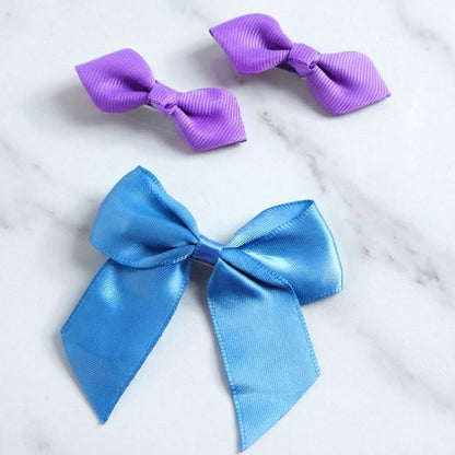 Set of three Wukusy satin ribbon bow hair clips with elegant, colorful bows for stylish hair accessories.