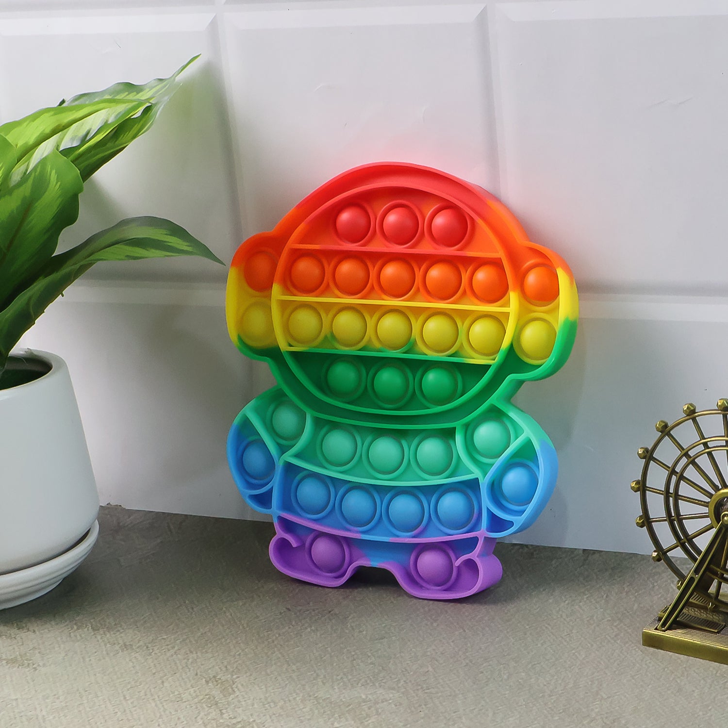 Wukusy Premium Astronaut Silicone Pop It Fidget Toy in vibrant colors, designed for stress relief and sensory play.