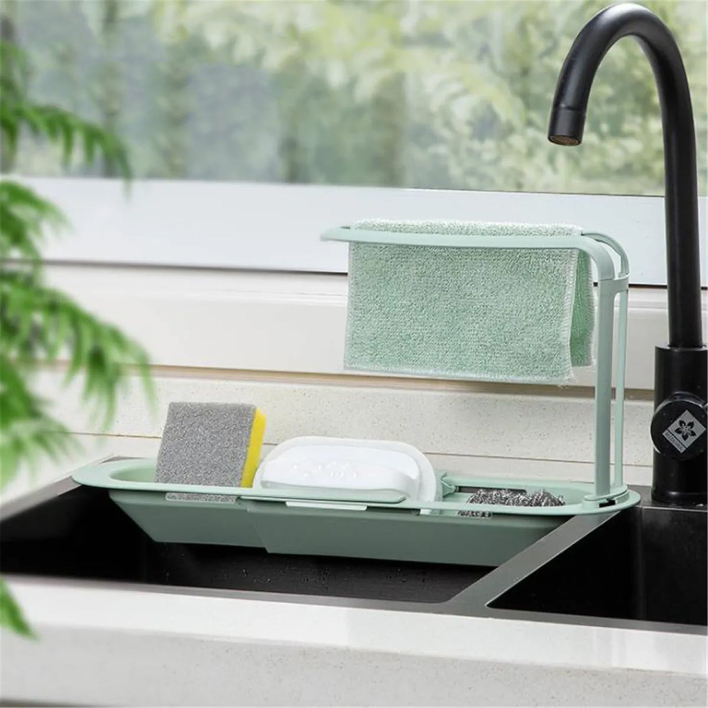 Plastic telescopic sink storage rack by Wukusy, adjustable and easy to install, holding cleaning supplies and kitchen tools.