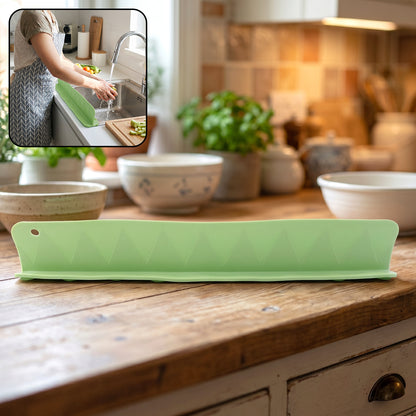 Flexible silicone kitchen sink splash guard in gray, 48 cm, designed to prevent water splashes and keep countertop dry.