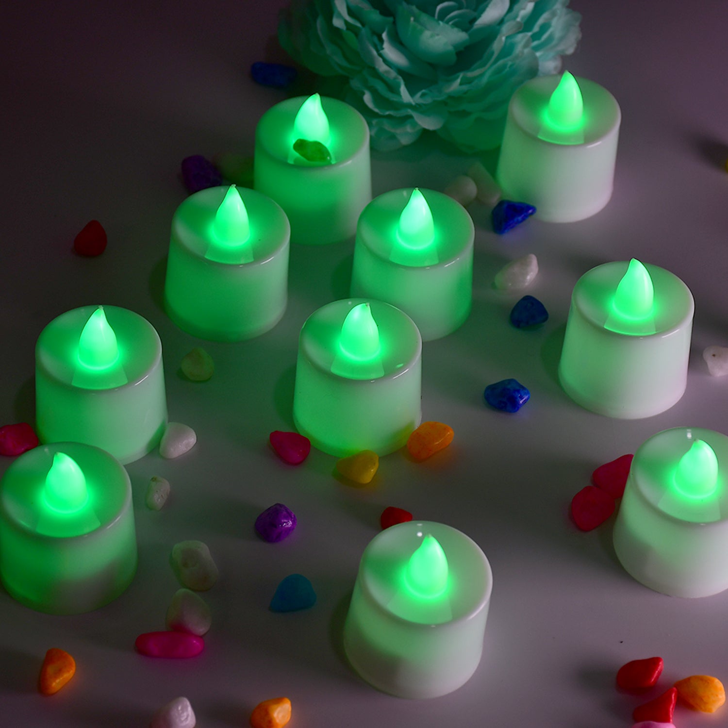 Set of 24 green flameless LED tealights by Wukusy, smokeless plastic candles for home decoration with a realistic flickering glow.