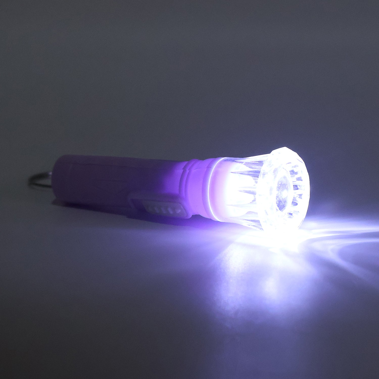 Wukusy mini LED flashlight keychain torch in mixed colors, compact toy with bright light and keyring attachment.