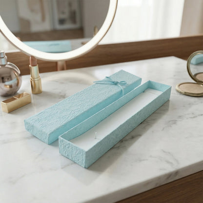 Elegant Wukusy long rectangular jewelry gift box with a decorative ribbon, perfect for jewelry presentation and gifting.