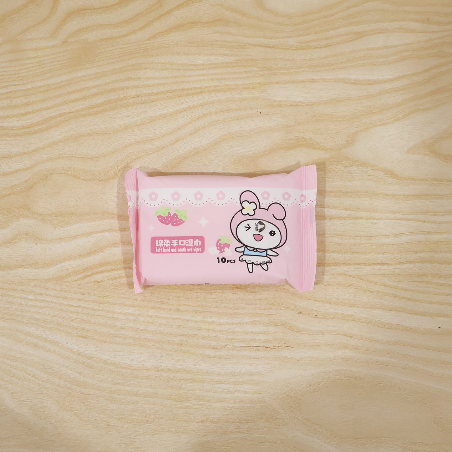 Cartoon printed soft wet wipes pack by Wukusy with 10 moist wipe sheets in a colorful packaging.