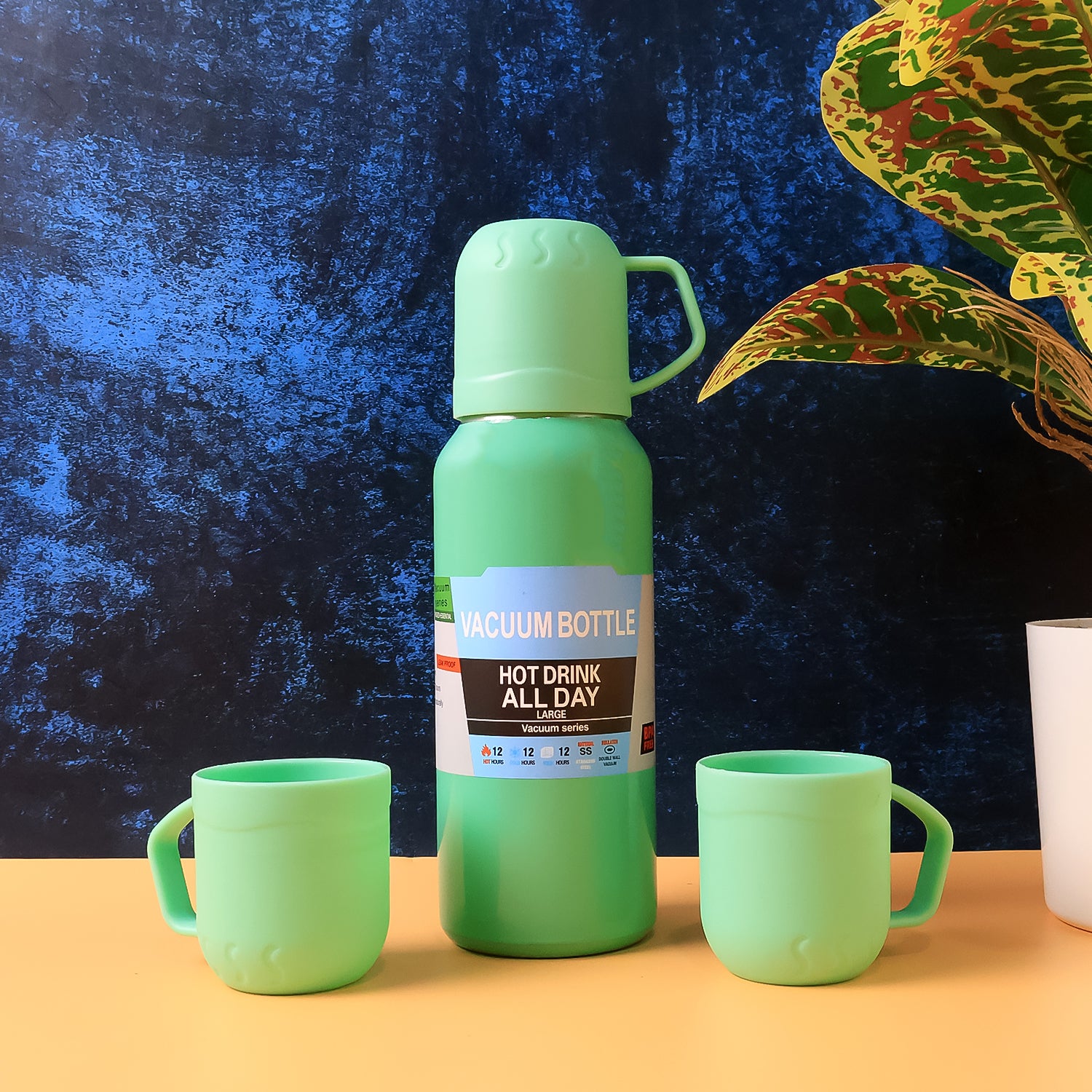 Wukusy green stainless steel vacuum flask set with 3 cups, approximately 500ml, showing the flask and cups on a white background.