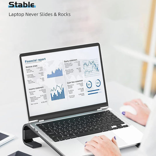 Wukusy fixed metal laptop stand for desk, 25-26 cm height, supporting laptop with a sturdy silver metal design.