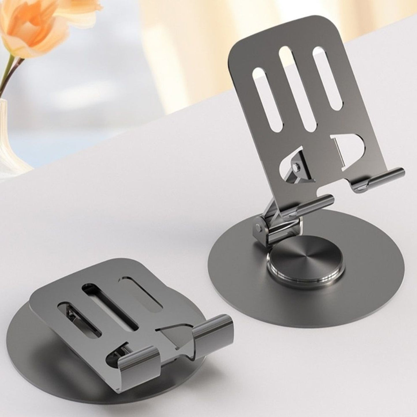 Wukusy foldable metal mobile stand for smartphones and tablets, lightweight and portable electronic accessory in silver finish.