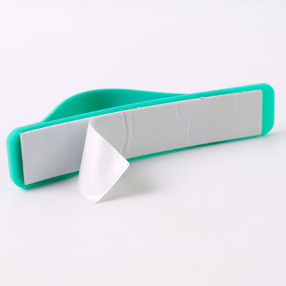 Teal green silicone phone loop finger holder grip strap on a smartphone, designed for secure handling and style.