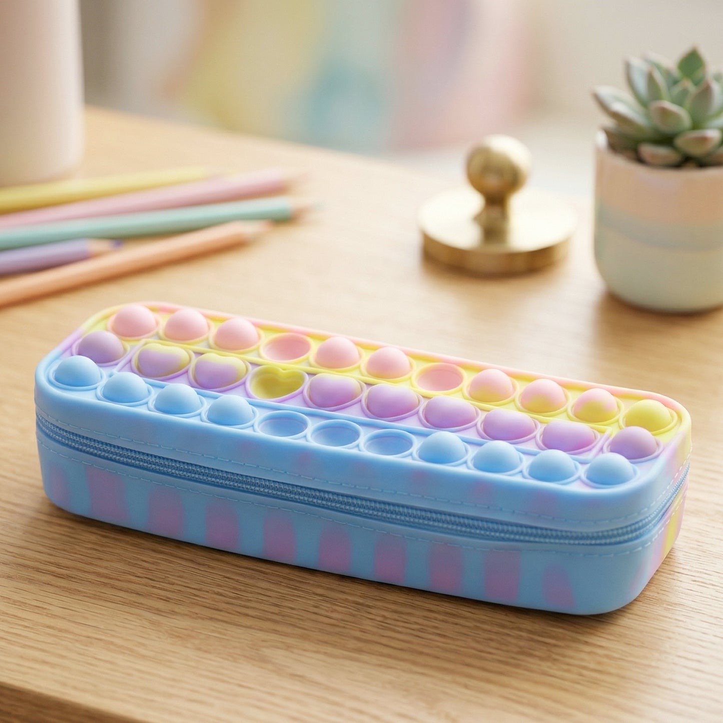 Wukusy Pop It silicone pencil pouch with zipper, vibrant colorful design, perfect for storing pens and stationery.