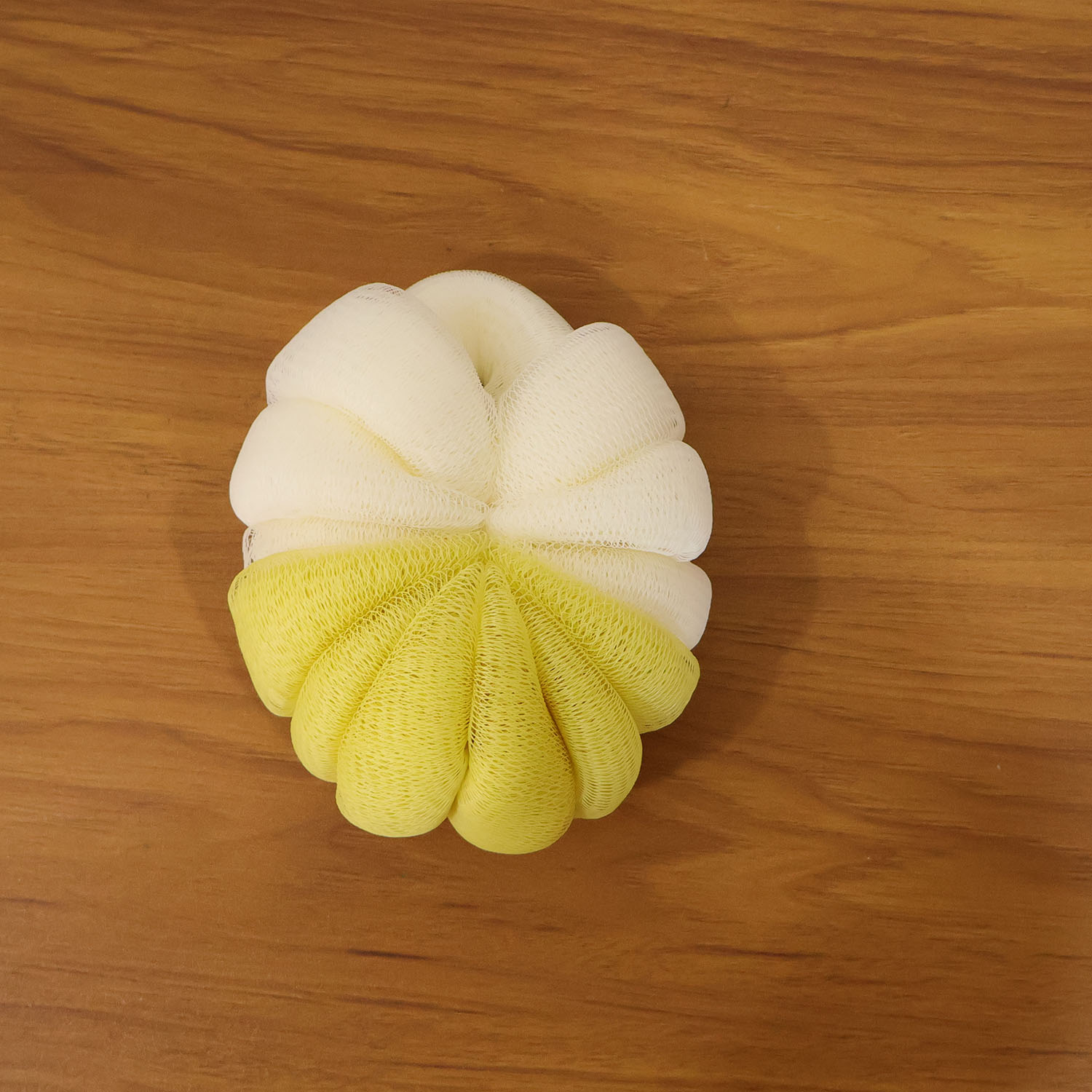 Wukusy dual color soft mesh bath loofah body scrubber showing textured mesh surface for gentle exfoliation.