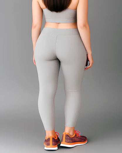 Ekom women's breathable and stretchable yoga tights, activewear gym leggings for girls and women, shown in a comfortable pose