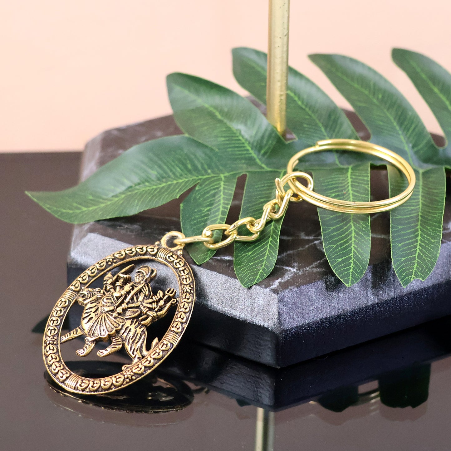 Golden Durga Maa keychain by Wukusy featuring intricate metal craftsmanship, perfect as a spiritual accessories piece.