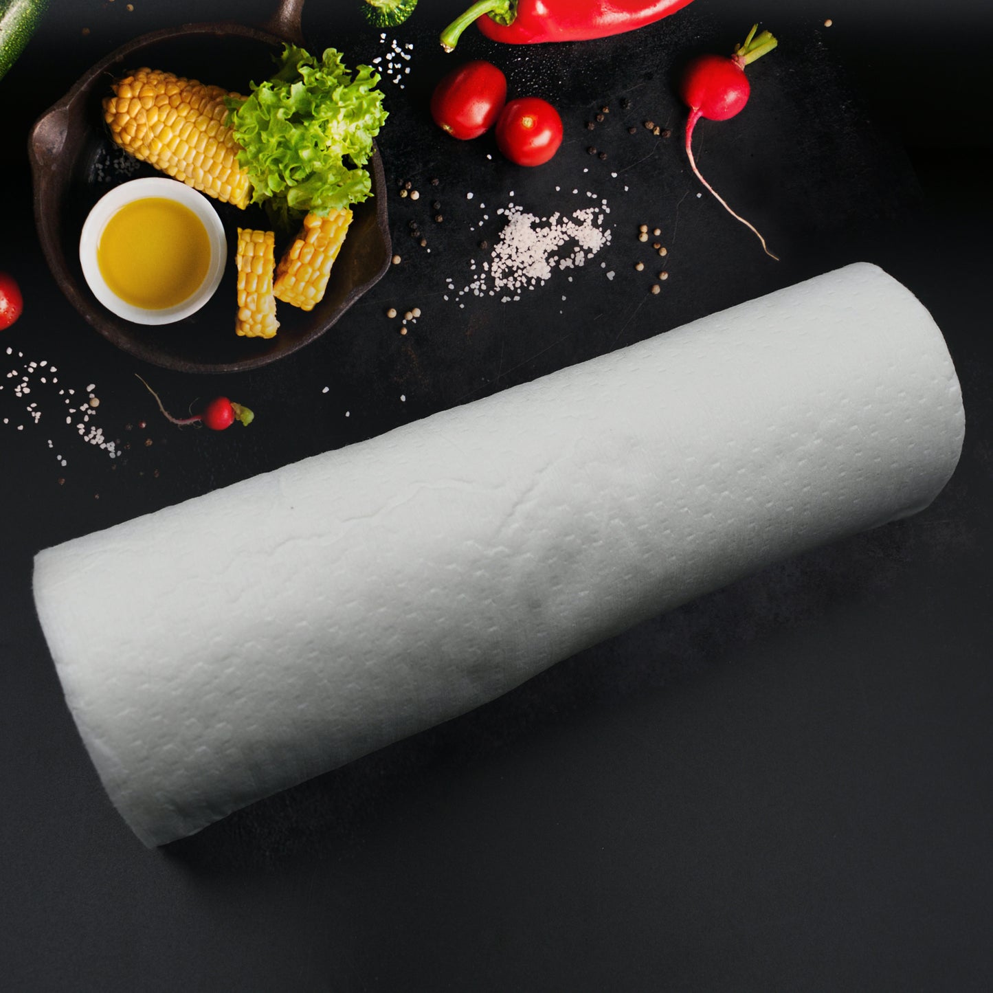 Wukusy non-woven reusable kitchen tissue roll with printed design, absorbent, washable dish cloth for cleaning and wiping surfaces.