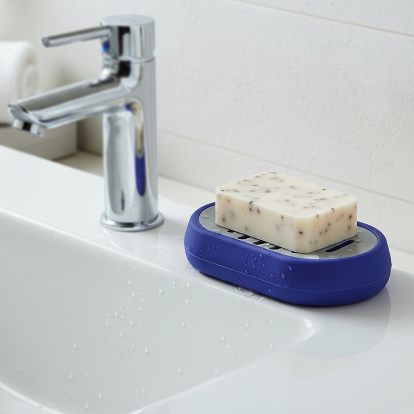 Wukusy plastic soap holder tray with drain slots, designed to keep soap dry and organized in the bathroom.