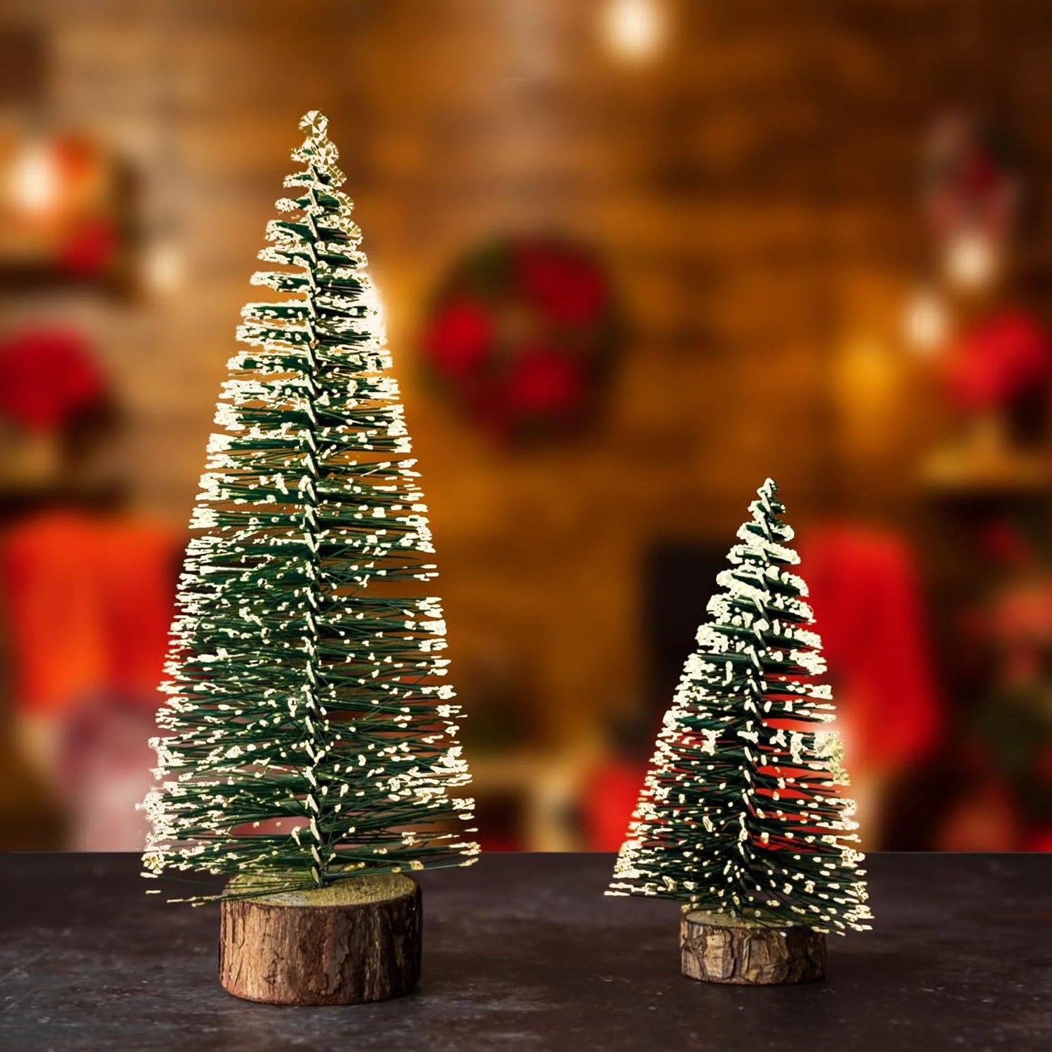 Mini artificial Christmas tree with snow effect from Wukusy, decorated with festive ornaments and pine branches.