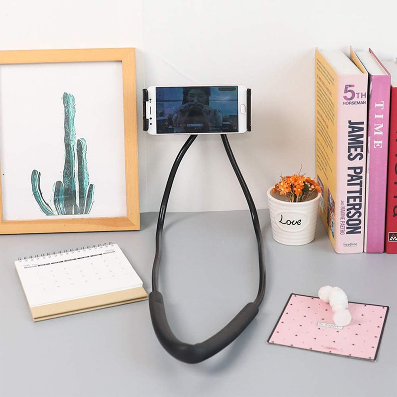 Wukusy neck phone holder desktop lazy stand displaying a smartphone securely resting on the adjustable stand.
