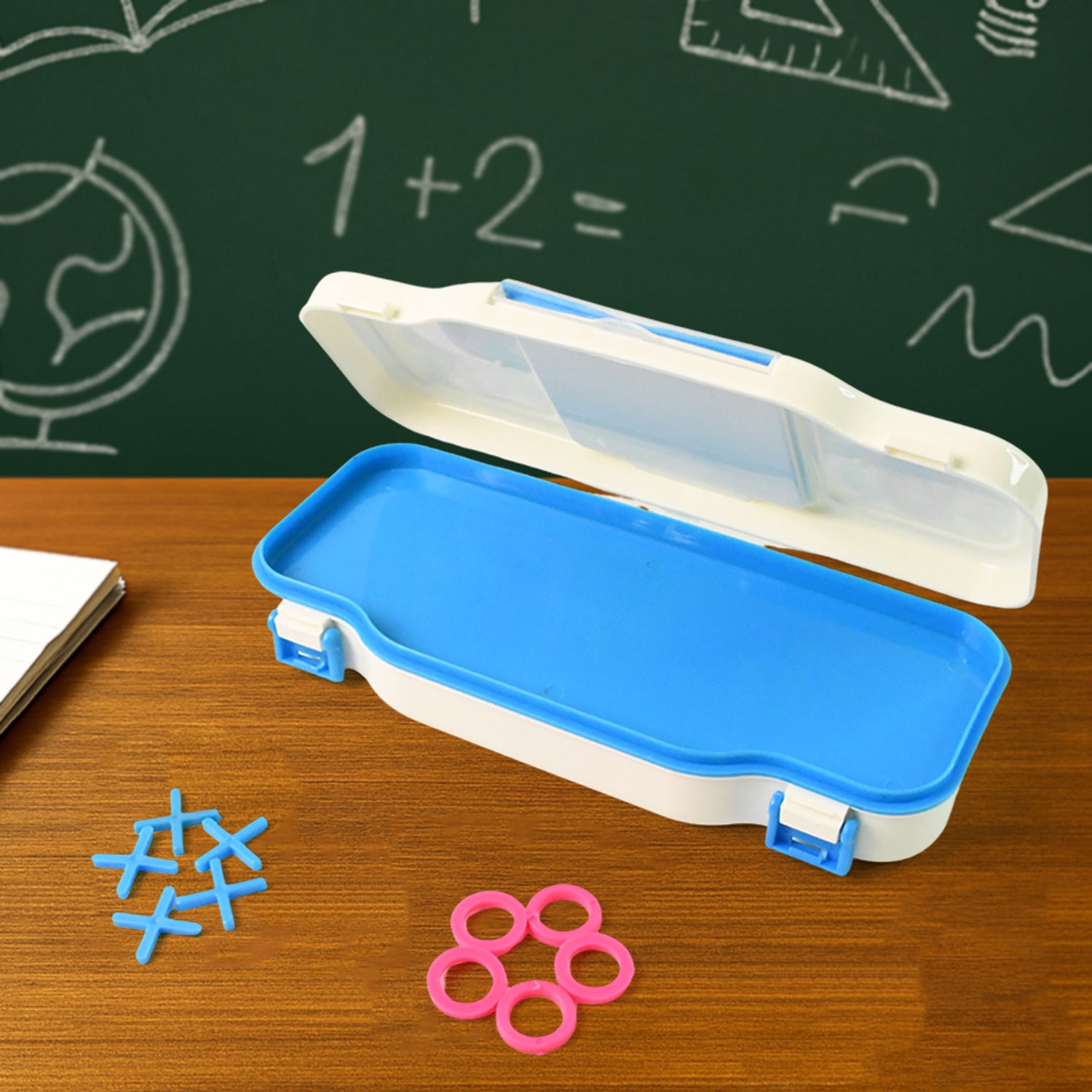 Kids pencil box with built-in Tic Tac Toe game by Wukusy, featuring colorful plastic storage for school supplies and fun gameplay.